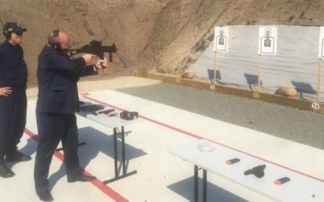 David Elliot shooting a submachinegun